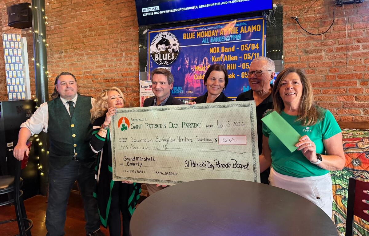The St. Patrick's Day parade in Springfield gives a check for $10,000 in proceeds to the Downtown Springfield Heritage Foundation, who is in turn giving the money to the new "My Heart's Downtown" initiative.