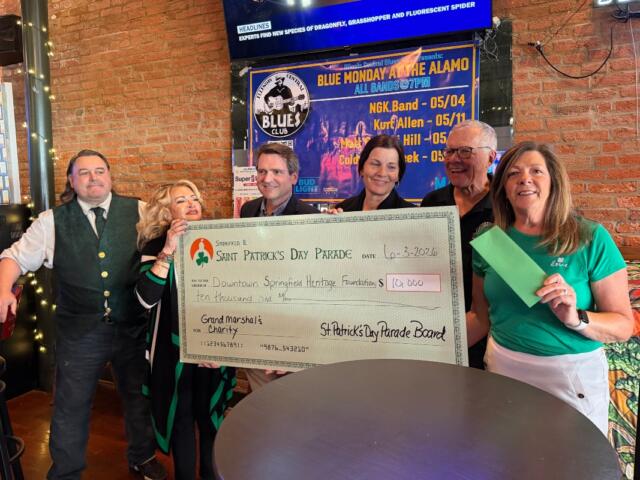 The St. Patrick's Day parade in Springfield gives a check for $10,000 in proceeds to the Downtown Springfield Heritage Foundation, who is in turn giving the money to the new "My Heart's Downtown" initiative.