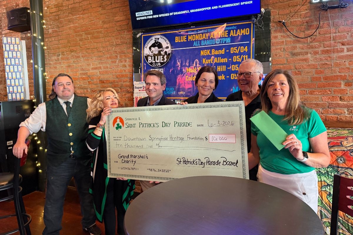 The St. Patrick's Day parade in Springfield gives a check for $10,000 in proceeds to the Downtown Springfield Heritage Foundation, who is in turn giving the money to the new "My Heart's Downtown" initiative.