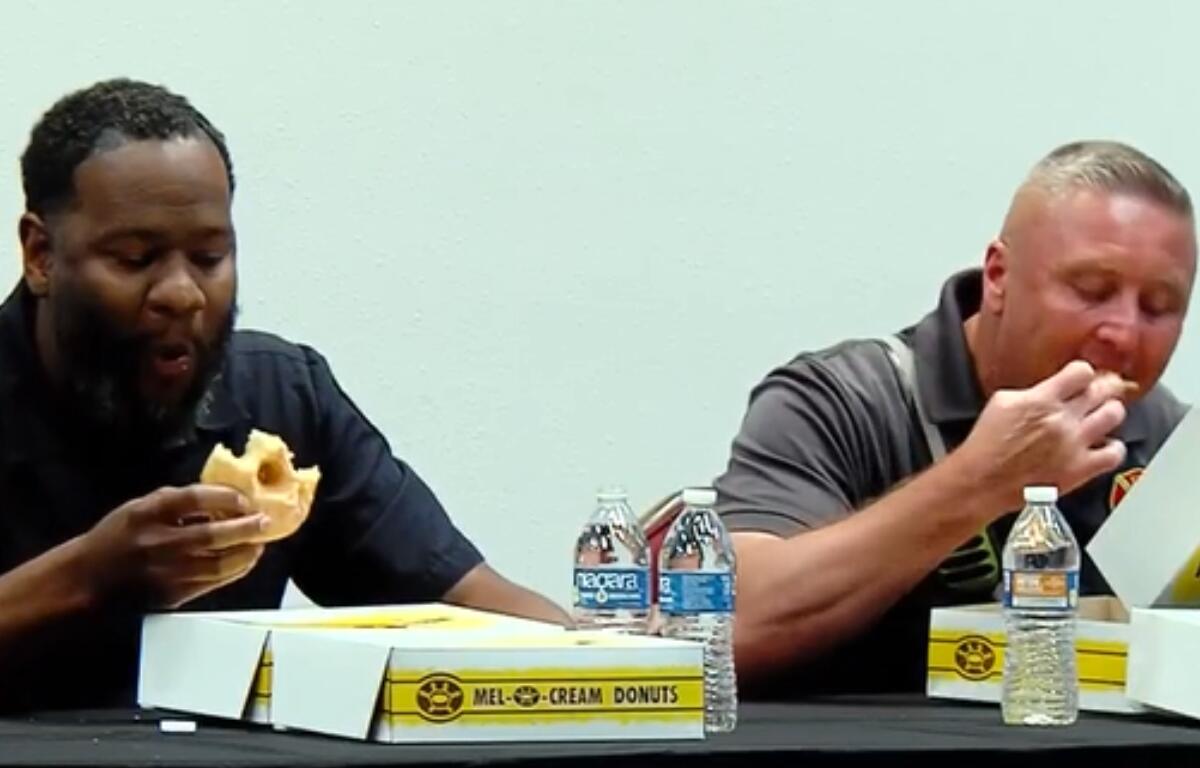 Springfield first responders participate in a donut-eating contest hosted by the Salvation Army for National Donut Day.