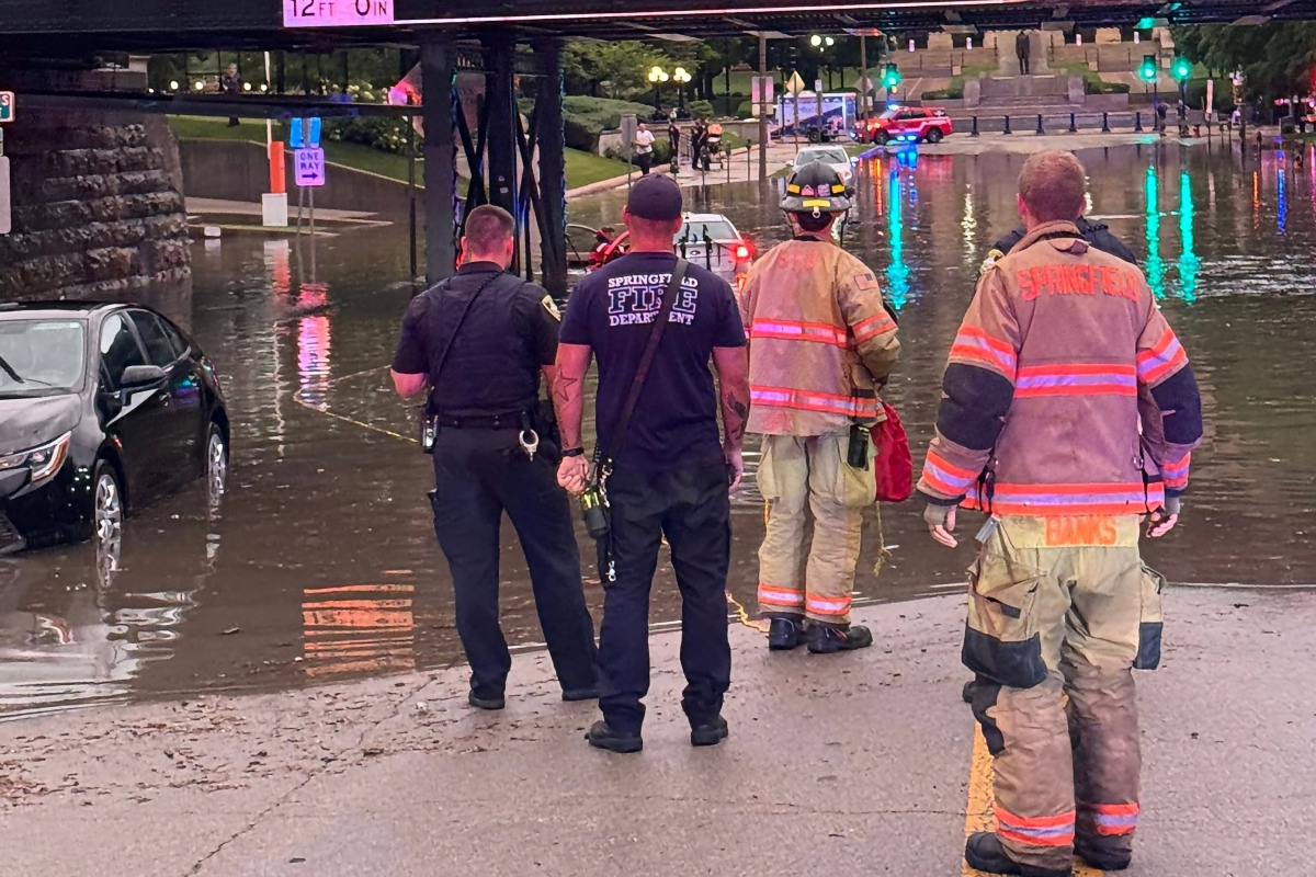Springfield Firefighters rescue a submerged vehicle Monday, June 8, near Third and Capitol Streets.