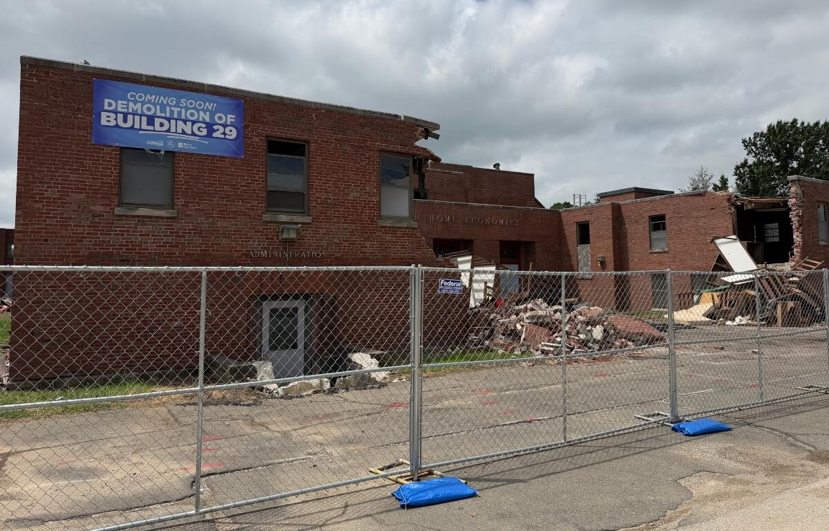 Fencing surrounds what's left of Illinois State Fairgrounds Building 29, which is in the process of being demolished.