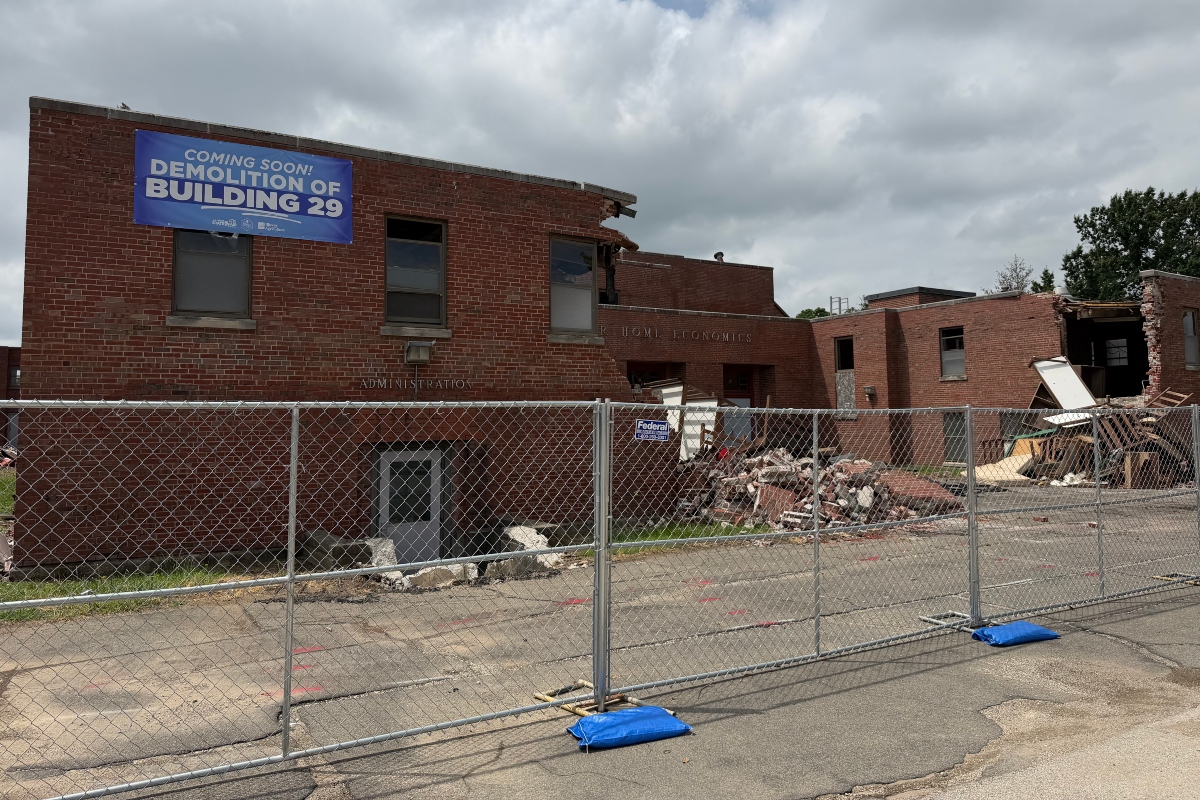 Fencing surrounds what's left of Illinois State Fairgrounds Building 29, which is in the process of being demolished.