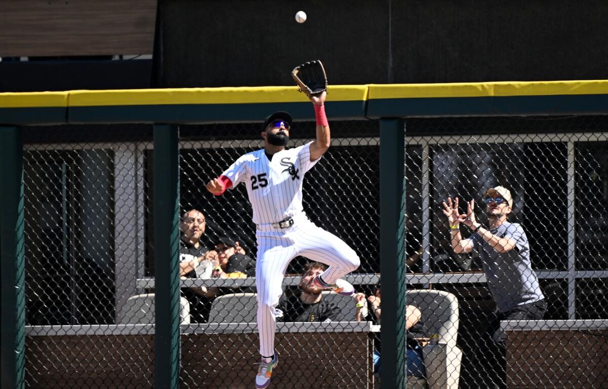 Chicago White Sox right fielder Derek Hill (25) catches a fly ball hit by Minnesota Twins' Tristan Gray during the seventh inning of a baseball game, Thursday, May 28, 2026, in Chicago. (AP Photo/Matt Marton)