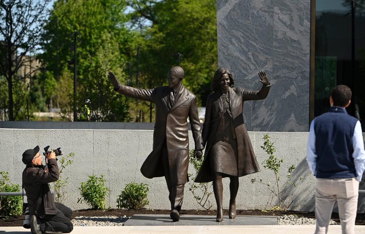 Statues of former President Barack Obama and former First Lady Michelle Obama at the Obama Presidential Center in Chicago, Thursday, May 28, 2026. (AP Photo/Paul Beaty)