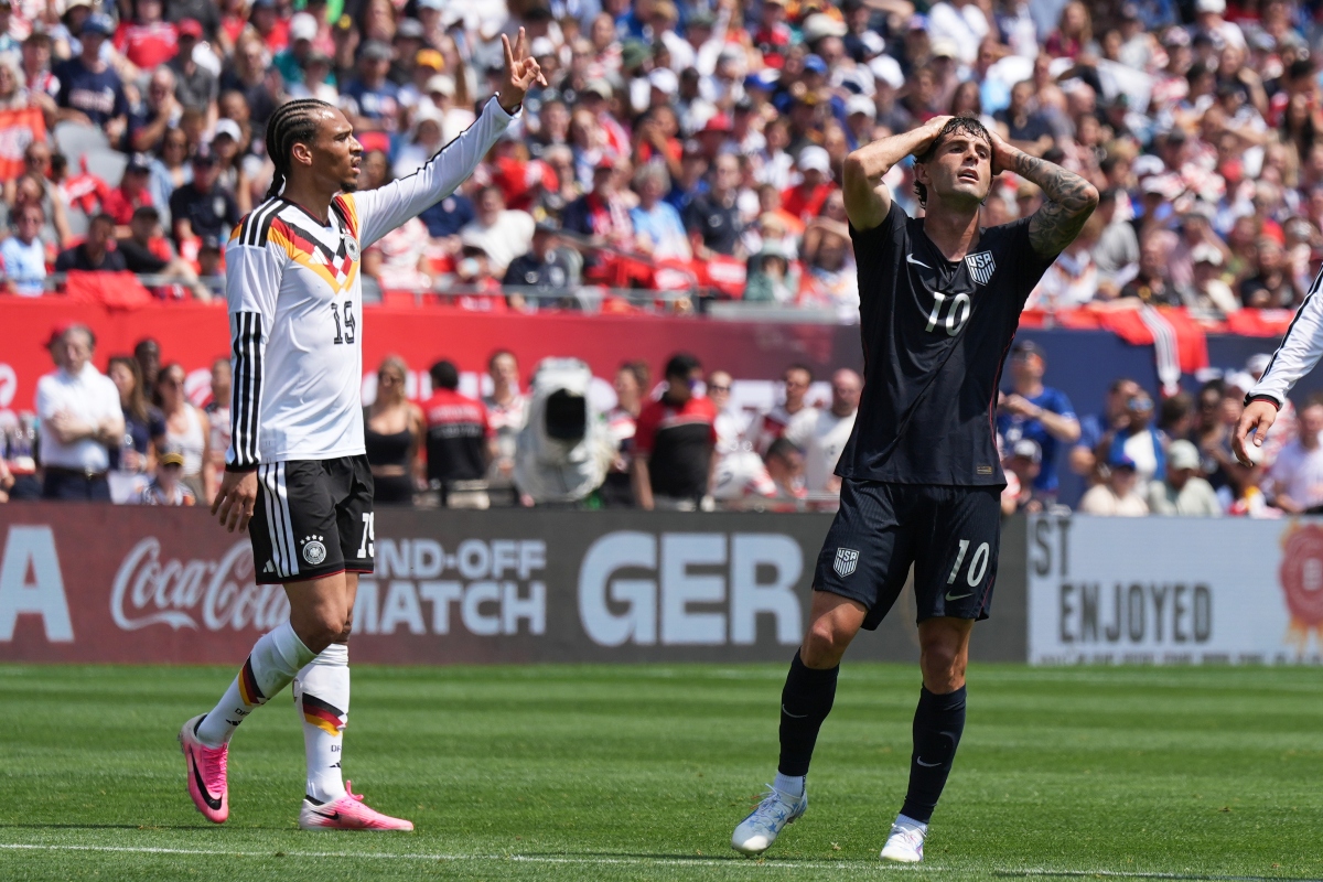 United States forward Christian Pulisic, right, reacts after a missed a shot as Germany forward Leroy Sané celebrates during the first half of an international friendly soccer match in Chicago, Saturday, June 6, 2026. (AP Photo/Nam Y. Huh)