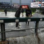 Grounds crew remove water from the field after severe thunderstorms came through the Chicago area before a baseball game between the Chicago White Sox and the Atlanta Braves, Wednesday, June 10, 2026, in Chicago. (AP Photo/David Banks)