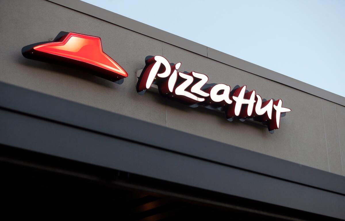 FILE - This Dec. 15, 2016, file photo shows a Pizza Hut restaurant in New Orleans. (AP Photo/Gerald Herbert, File)