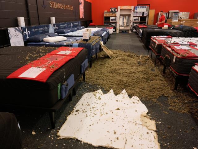 Damage from a collapsed roof is seen at Big Red Appliances &amp; Mattresses in Florence, Ky, Thursday, June 18, 2026, after severe weather moved through the region. (AP Photo/Carolyn Kaster)