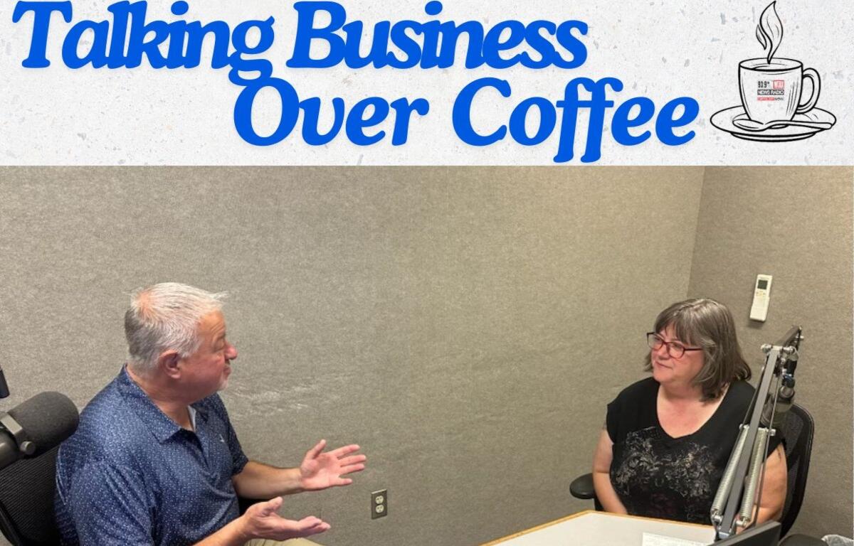 Chris Bullock (left) talks with Laurie Pullen about the Annual Artisan Market