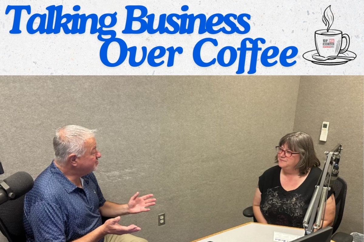 Chris Bullock (left) talks with Laurie Pullen about the Annual Artisan Market