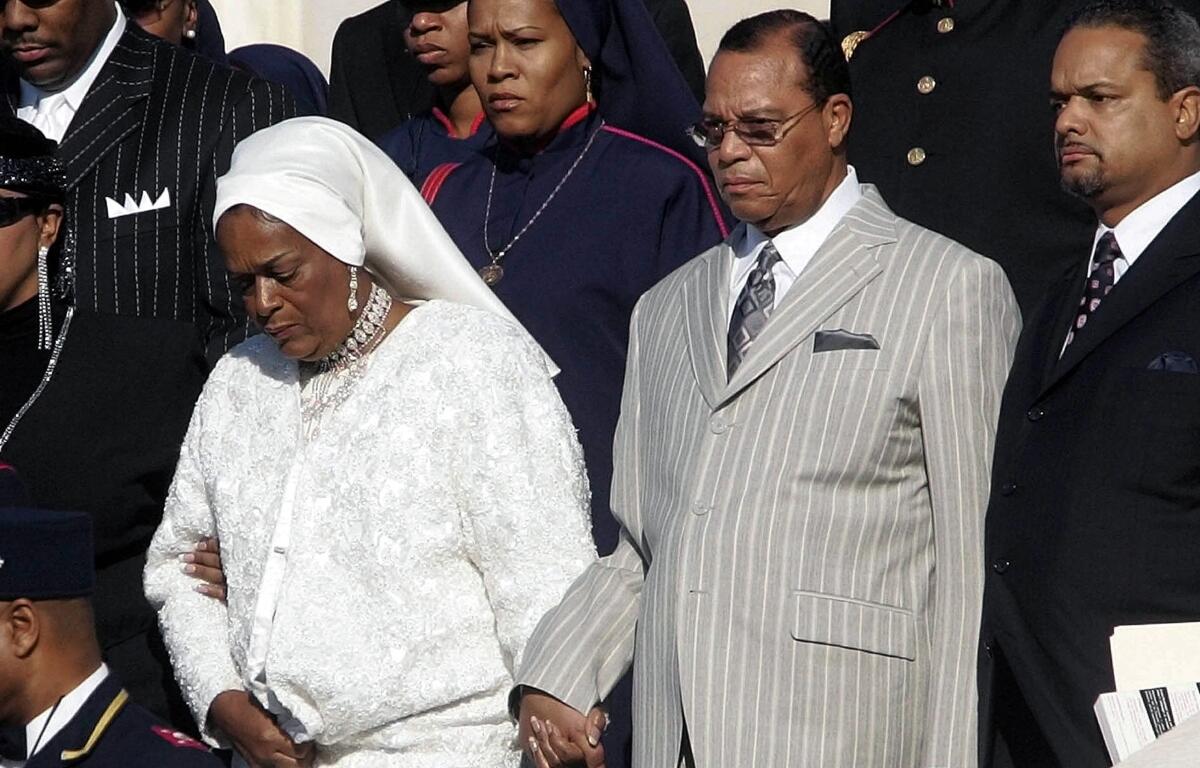 FILE - Nation of Islam leader Louis Farrakhan, center from Chicago, Il., walks down the steps of the Capital Building with his wife, Mother Khadijah Farrakhan, left, as they arrive at the Millions More Movement on the National Mall, Saturday, Oct. 15, 2005 in Washington. (AP Photo/Pablo Martinez Monsivais, File)