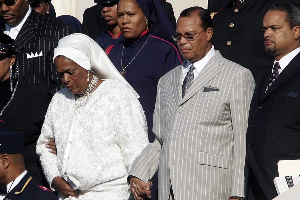 FILE - Nation of Islam leader Louis Farrakhan, center from Chicago, Il., walks down the steps of the Capital Building with his wife, Mother Khadijah Farrakhan, left, as they arrive at the Millions More Movement on the National Mall, Saturday, Oct. 15, 2005 in Washington. (AP Photo/Pablo Martinez Monsivais, File)