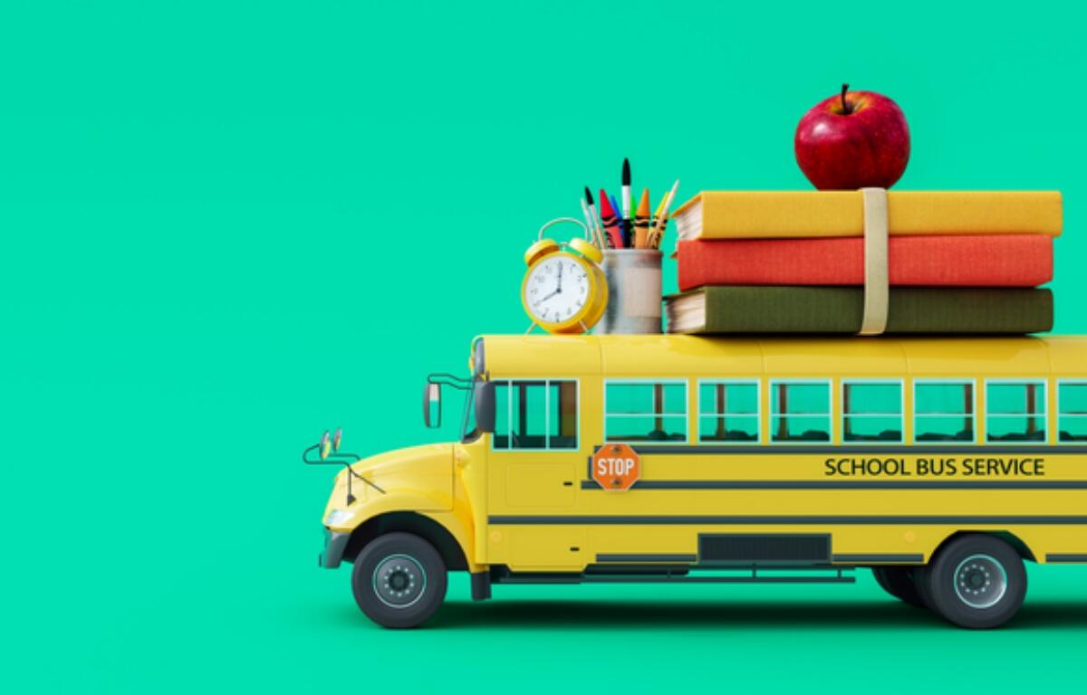 Back-to-school scene: yellow school bus with books, an apple, clock, and pencils on top against a teal background.