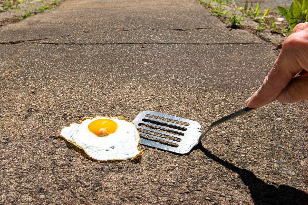 "It's so hot you could fry and egg on the sidewalk"