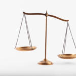 Brass balance scale with two hanging pans, symbolizing justice and fairness on a white background.