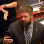 Rep. Harry Benton takes a picture during a joint session of the Illinois House in May 2026. (Capitol News Illinois photo by Jerry Nowicki)