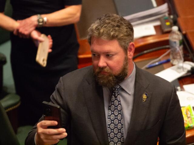 Rep. Harry Benton takes a picture during a joint session of the Illinois House in May 2026. (Capitol News Illinois photo by Jerry Nowicki)