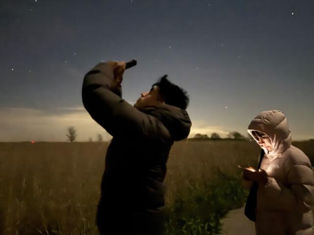 Siblings Dominique and Martín Farfán chose to spend their visit in Illinois stargazing at the state’s only International Dark Sky Park in Champaign County. (Medill Illinois News Bureau photo by Julia Levy)
