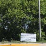 A sign provides notice for a public meeting of the Hoffman Estates Plan Commission to discuss rezoning the 186-acre property at Higgins Road and Route 59. The developer notified the village on July 1 that it would withdraw the rezoning request after community backlash. (Capitol News Illinois photo by Maggie Dougherty)