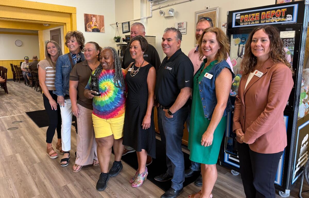 Rachel Lewis, center in tie-dye, is the 2nd Quarter 2026 winner of the Central Illinois Customer Service Association "WOW Award."