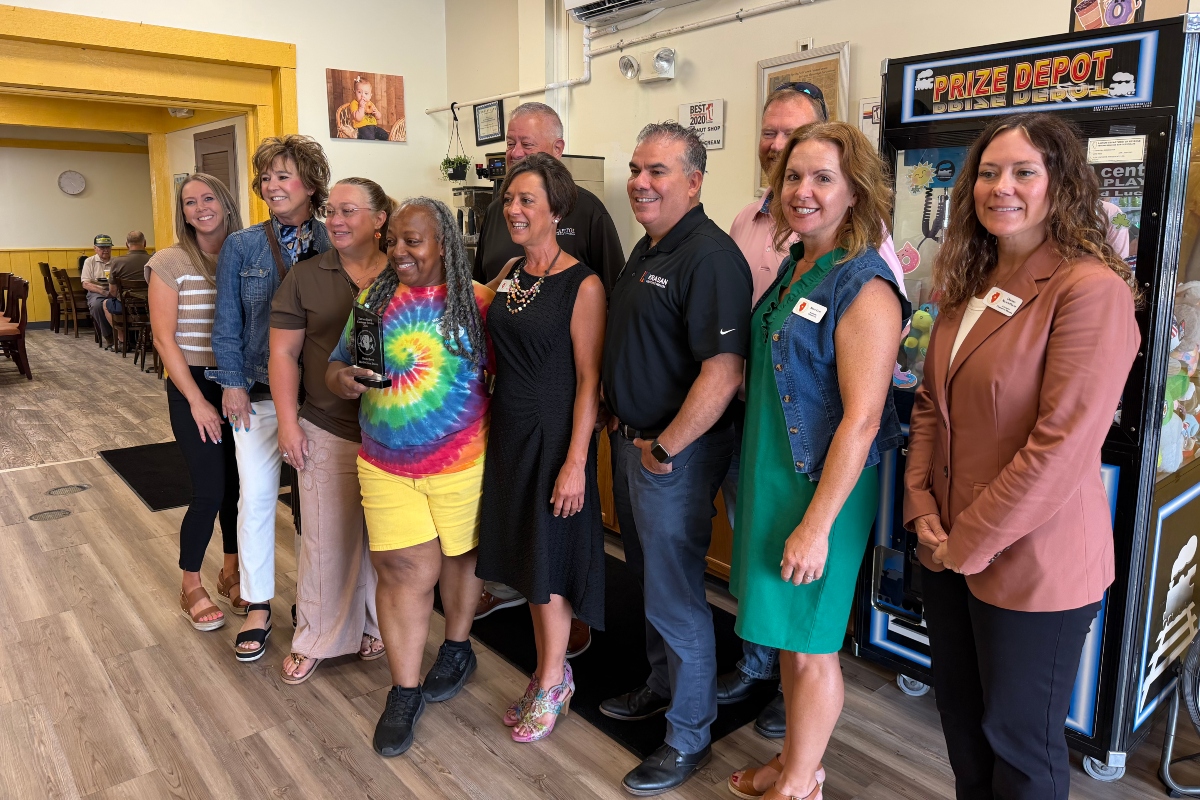 Rachel Lewis, center in tie-dye, is the 2nd Quarter 2026 winner of the Central Illinois Customer Service Association "WOW Award."