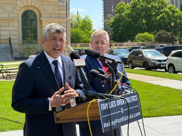 Aaron Del Mar, left, Republican candidate for Lieutenant Governor, speaks alongside Governor candidate Darren Bailey, at an April, 2026 news conference outside the Illinois State Capitol.