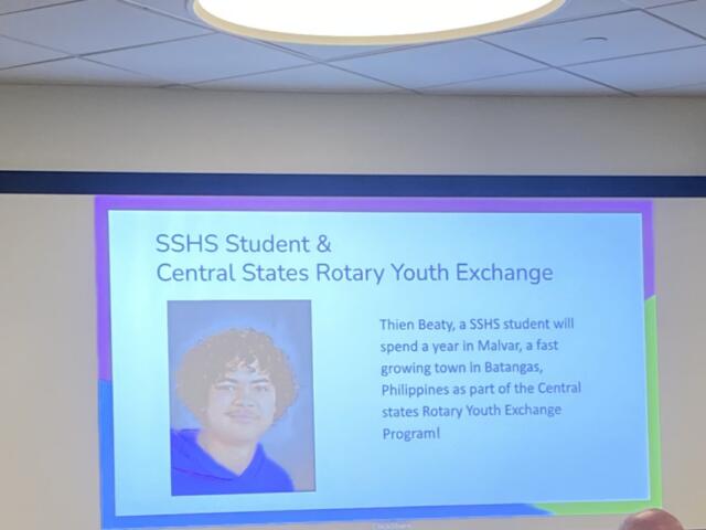 Slide announcing SSHS student & Central States Rotary Youth Exchange with a portrait photo on the left.