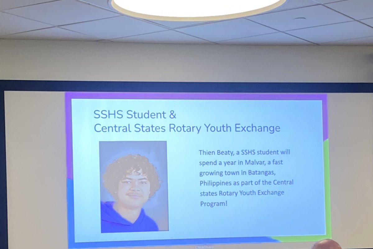 Slide announcing SSHS student & Central States Rotary Youth Exchange with a portrait photo on the left.