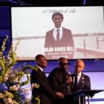 Elmore Wonsley, center, speaks next to attorney Ben Crump, left, and Rev. Al Sharpton during a memorial service for Nolan Xavier Wells, an 18-year-old found dead after taking a July 4 boat trip with friends, Monday, July 20, 2026, in Ocean Springs, Miss. (AP Photo/Gerald Herbert)