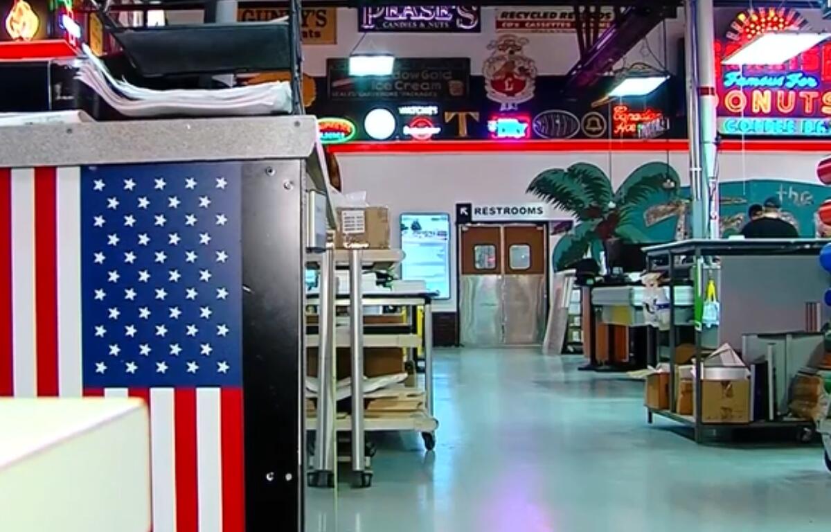 Vintage signs and artifacts line the walls and floors of Ace Sign Company.