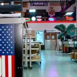 Vintage signs and artifacts line the walls and floors of Ace Sign Company.