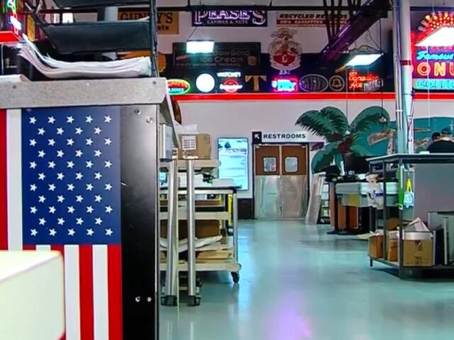 Vintage signs and artifacts line the walls and floors of Ace Sign Company.