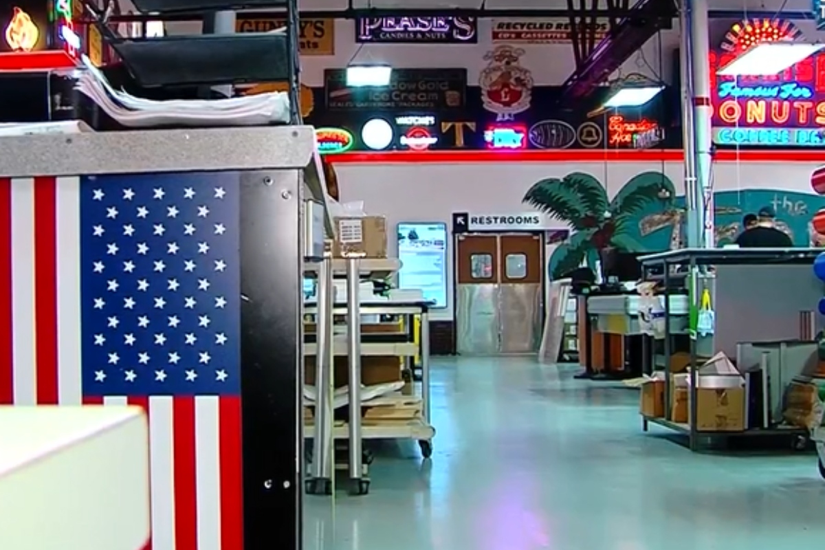 Vintage signs and artifacts line the walls and floors of Ace Sign Company.