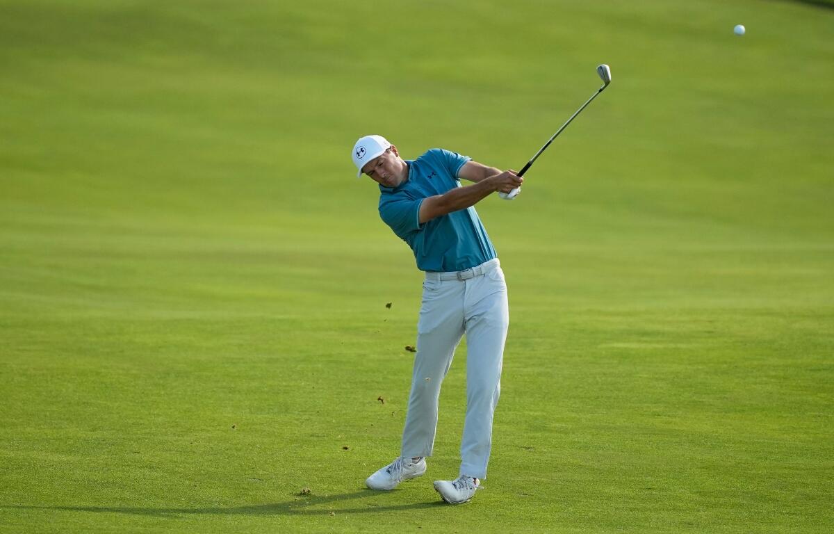 Jordan Spieth hits from the fairway on the 14th hole during the first round of the U.S. Open golf tournament at Shinnecock Hills Golf Club in Southampton, N.Y., Thursday, June 18, 2026.(AP Photo/Gerald Herbert)