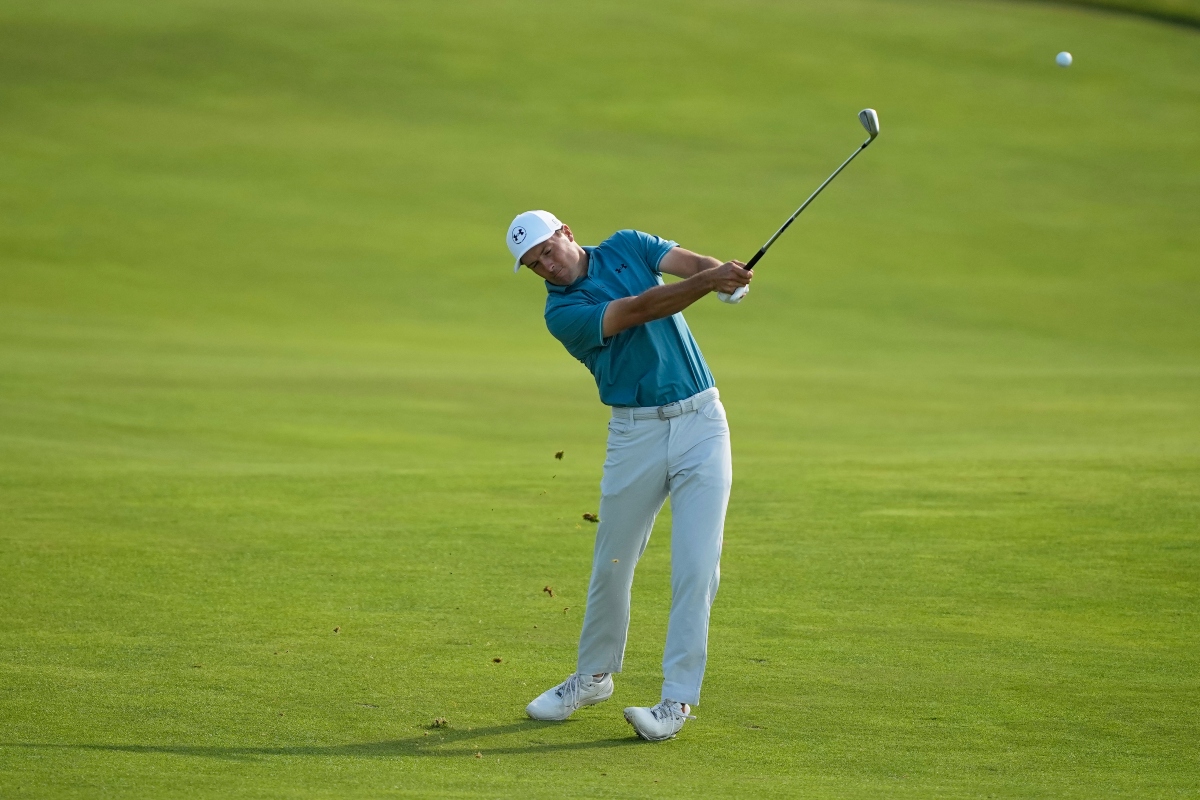 Jordan Spieth hits from the fairway on the 14th hole during the first round of the U.S. Open golf tournament at Shinnecock Hills Golf Club in Southampton, N.Y., Thursday, June 18, 2026.(AP Photo/Gerald Herbert)