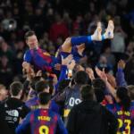 FILE - Barcelona's Robert Lewandowski is thrown into the air by his teammates after his last game for the club at the end of the Spanish La Liga soccer match between FC Barcelona and Real Betis in Barcelona, Spain, May 17, 2026. (AP Photo/Joan Mateu Parra, File)