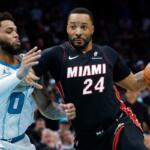 FILE - Miami Heat guard Norman Powell (24) drives to the basket against Charlotte Hornets forward Miles Bridges during the second half of an NBA play-in tournament basketball game in Charlotte, N.C., April 14, 2026. (AP Photo/Nell Redmond, File)