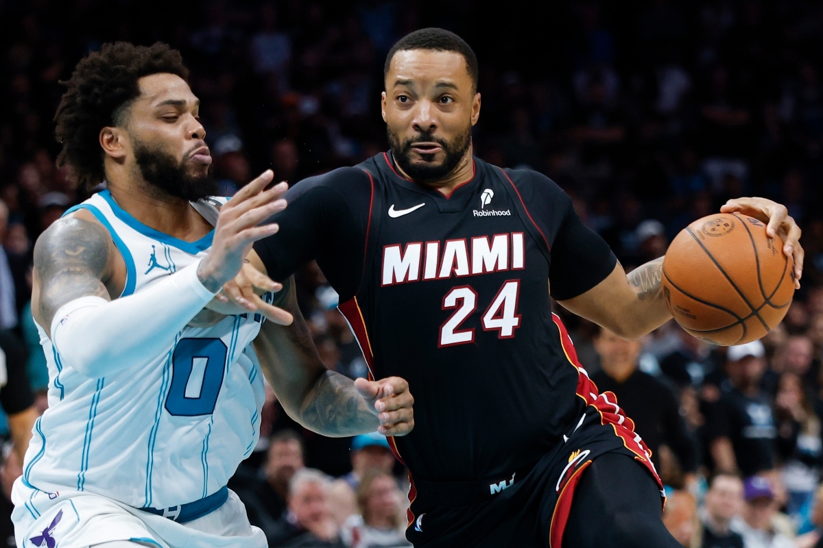 FILE - Miami Heat guard Norman Powell (24) drives to the basket against Charlotte Hornets forward Miles Bridges during the second half of an NBA play-in tournament basketball game in Charlotte, N.C., April 14, 2026. (AP Photo/Nell Redmond, File)