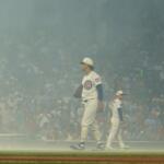 Chicago Cubs pitcher Shota Imanaga stands amidst smoke after fireworks before a baseball game against the St. Louis Cardinals, Saturday, July 4, 2026, in Chicago. (AP Photo/David Banks)