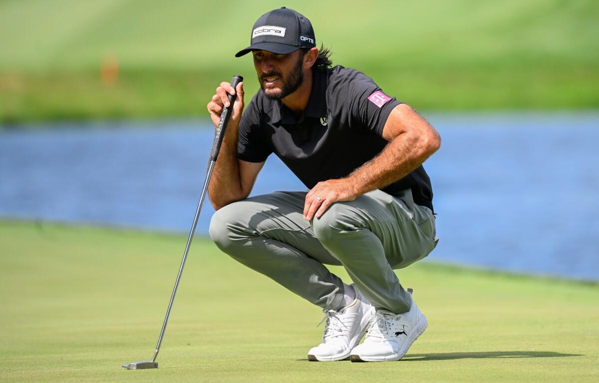 Max Homa lines up a putt on the 18th hole during the final round of the John Deere Classic golf tournament, Sunday, July 5, 2026, in Silvis, Ill. (AP Photo/Matt Marton)