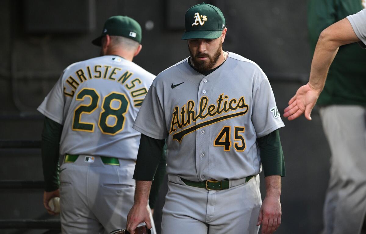 The Athletics relief pitcher Aaron Civale (45) reacts in the dugout after being pulled during the fifth inning of a baseball game against the Chicago White Sox in Chicago, Friday, July 10, 2026. (AP Photo/Paul Beaty)