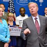 FILE - Republican presidential candidate, Sen. Lindsey Graham, R-S.C., accompanied by his sister Darline, left, speaks at the GOP headquarters in Columbia, S.C., Sept. 1, 2015, where he filed for the South Carolina Presidential Primary. (AP Photo/Richard Shiro, File)