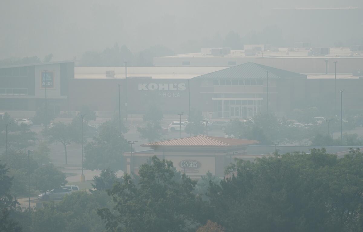A general view of street mall during poor air quality due to dense smoke from Canadian wildfires in Glenview, Ill., Thursday, July 16, 2026. (AP Photo/Nam Y. Huh) CORRECTION: Glenview, not Northbrook