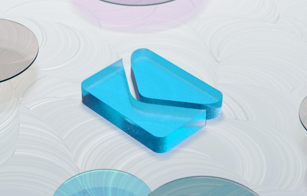 Blue translucent geometric block resting on a white swirled surface with circular reflective discs nearby (decorative image)