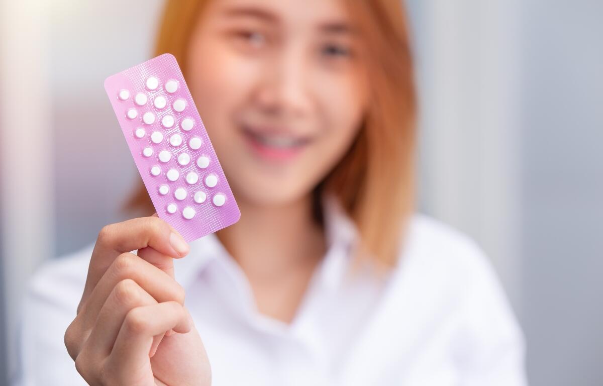 teen girl with birth control pills Combined Oral Contraceptive Pill, COCP show up happy smile