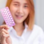 teen girl with birth control pills Combined Oral Contraceptive Pill, COCP show up happy smile
