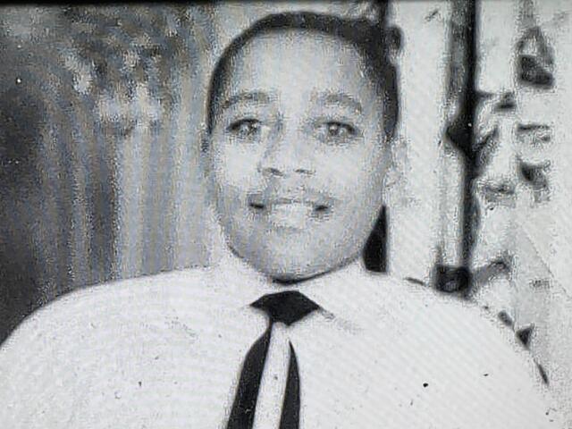 Smiling man in a white shirt and black tie looking at the camera. (Portrait)