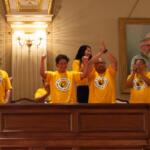 Supporters of a bill to allow rideshare drivers to unionize celebrate in the House gallery in May after the bill passed. The governor signed it into law on Aug. 7. (Capitol News Illinois photo by Jerry Nowicki)