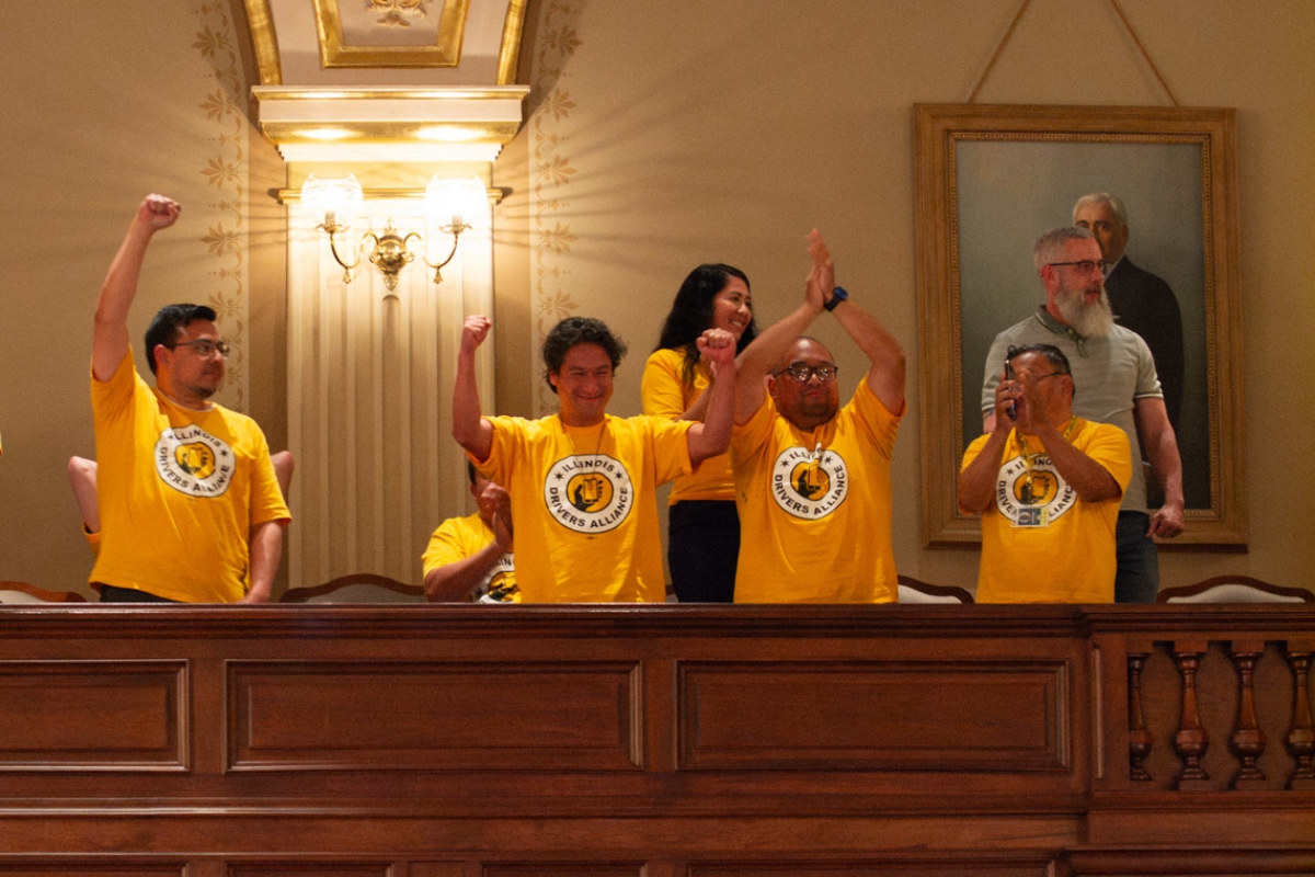 Supporters of a bill to allow rideshare drivers to unionize celebrate in the House gallery in May after the bill passed. The governor signed it into law on Aug. 7. (Capitol News Illinois photo by Jerry Nowicki)